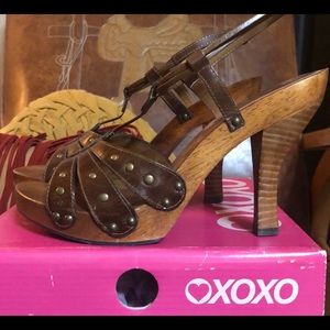 Brown strap on leather heels.